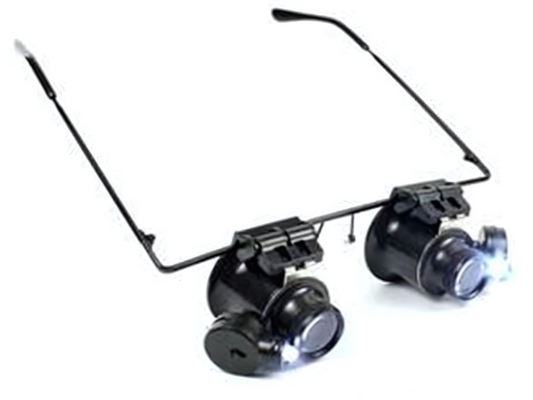 Gafas lupa binoculares con aumento 20× e iluminación LED integrada, ideales para trabajos de precisión y lectura detallada.