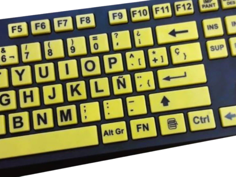 Teclado de alto contraste amarillo y negro que facilita la lectura de las teclas.