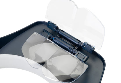 Dispositivo de aumento manos libres con luz LED y 4 lentes de aumento intercambiables.